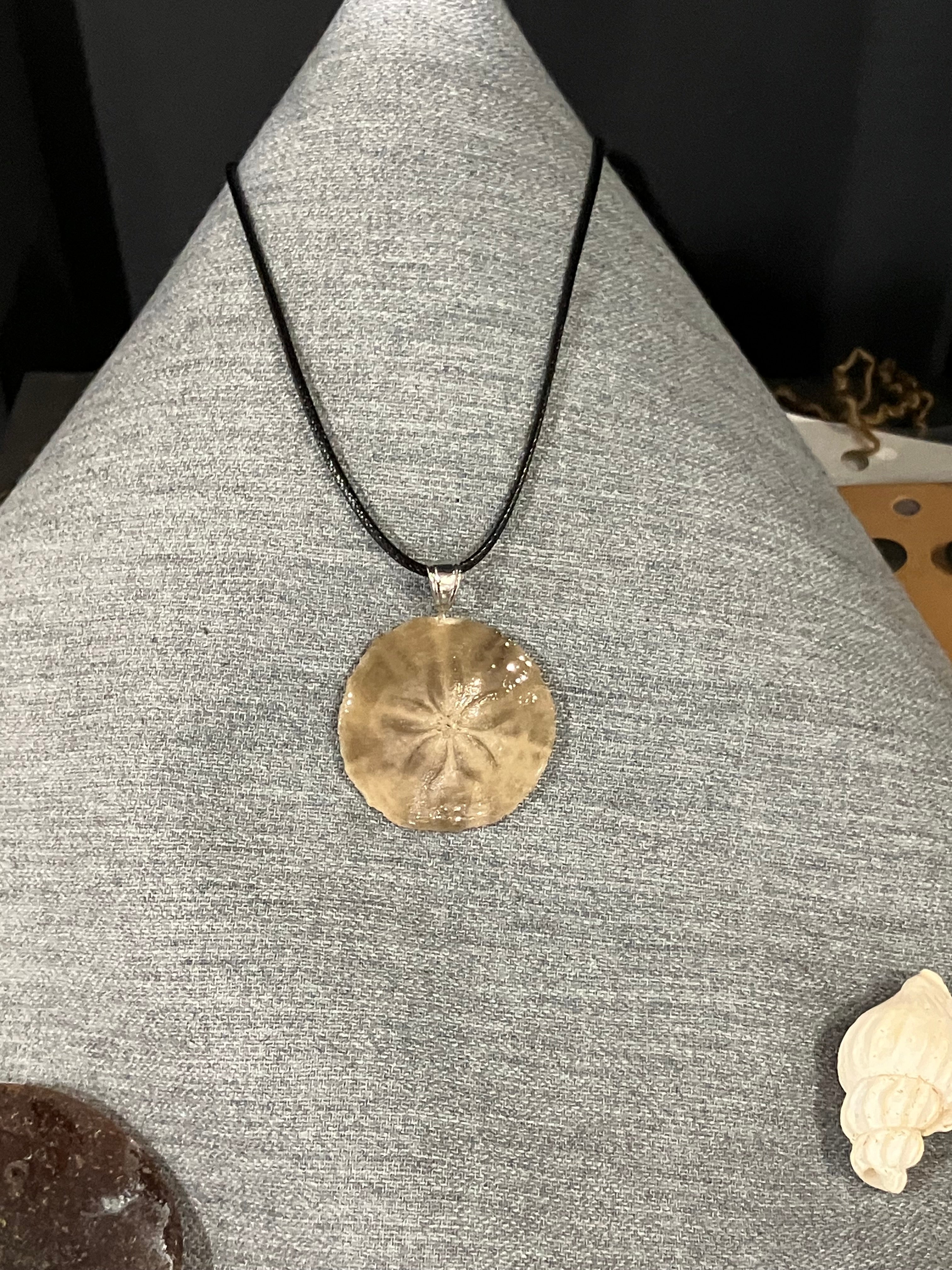 Sand dollar necklace on black cord