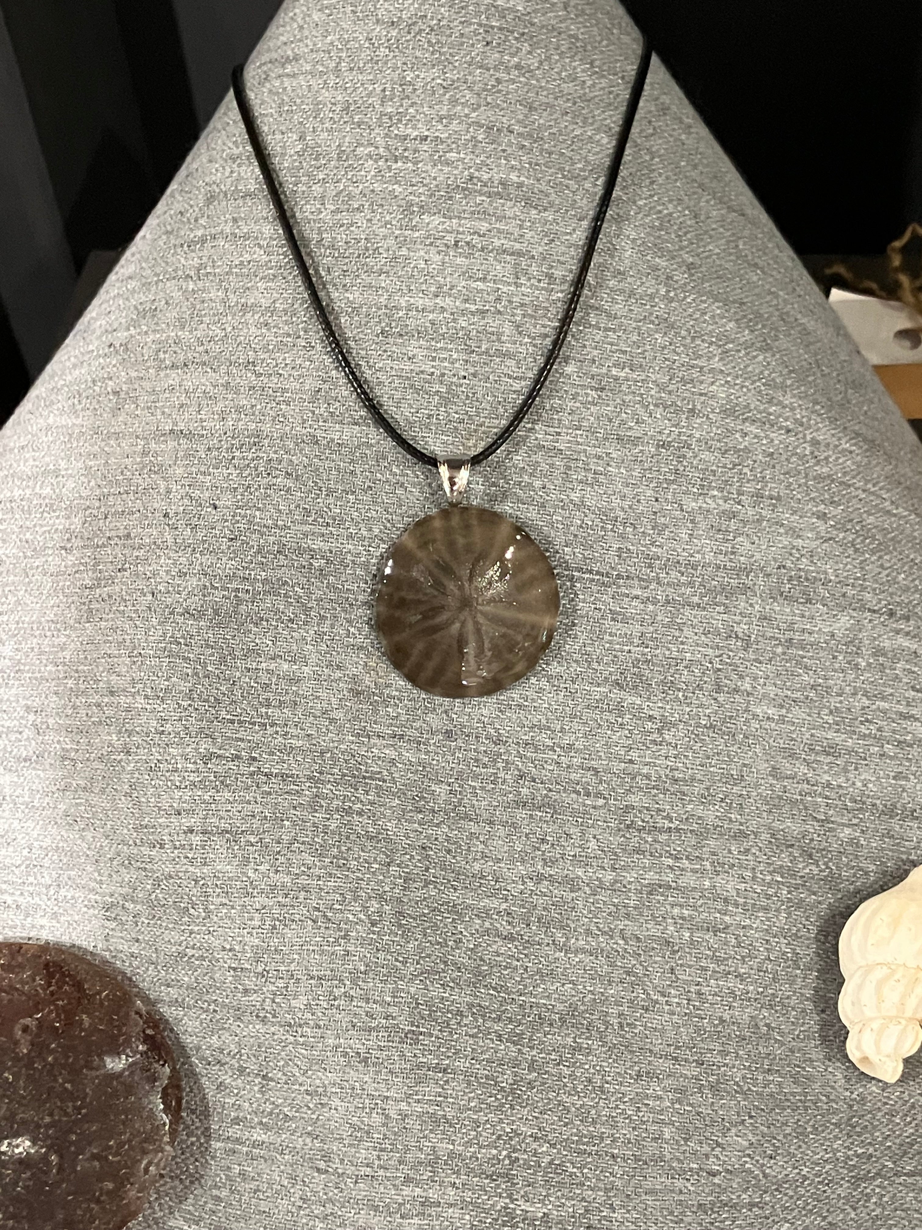 Sand dollar necklace on black cord
