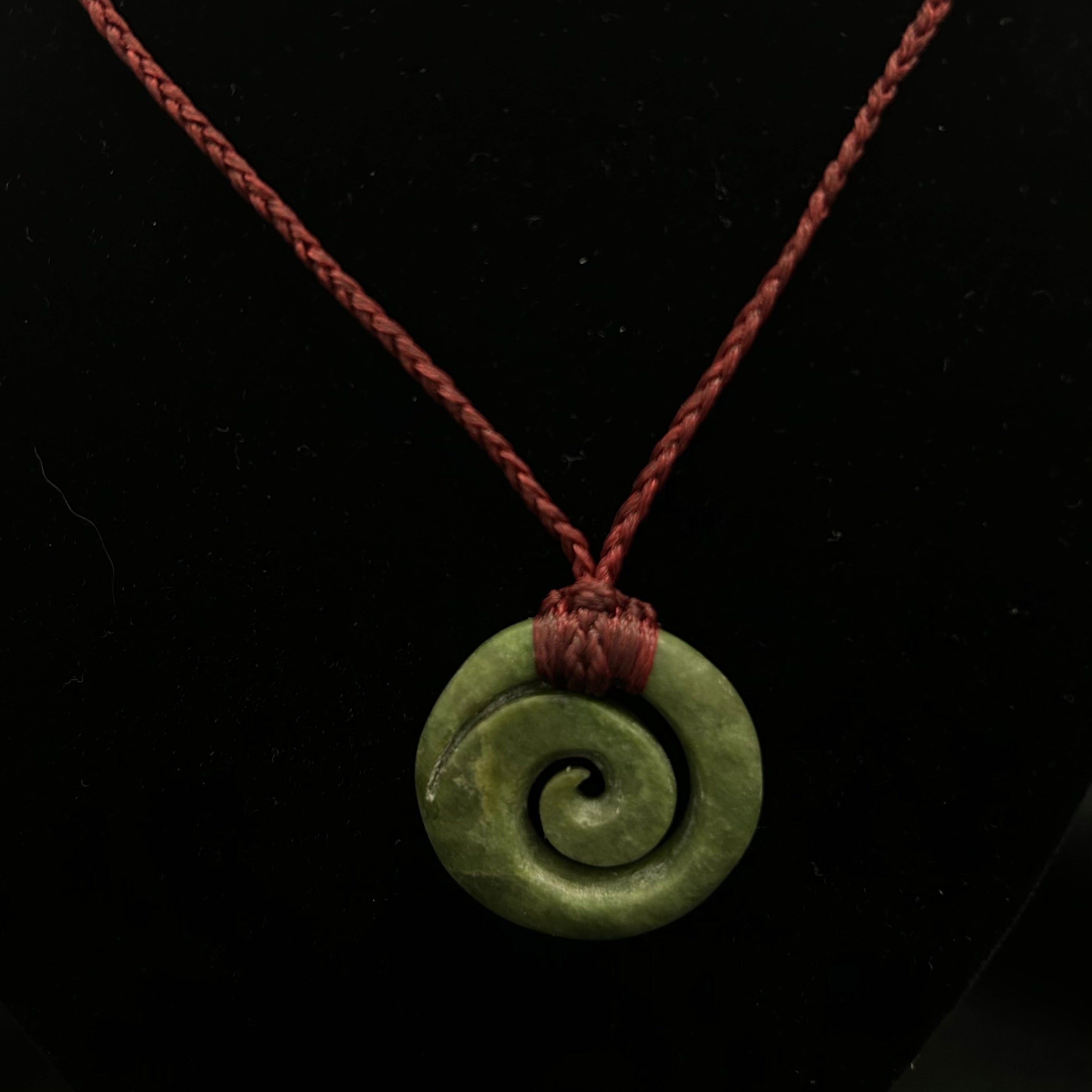 Koru Nephrite Jade Spiral with Burgundy Cord